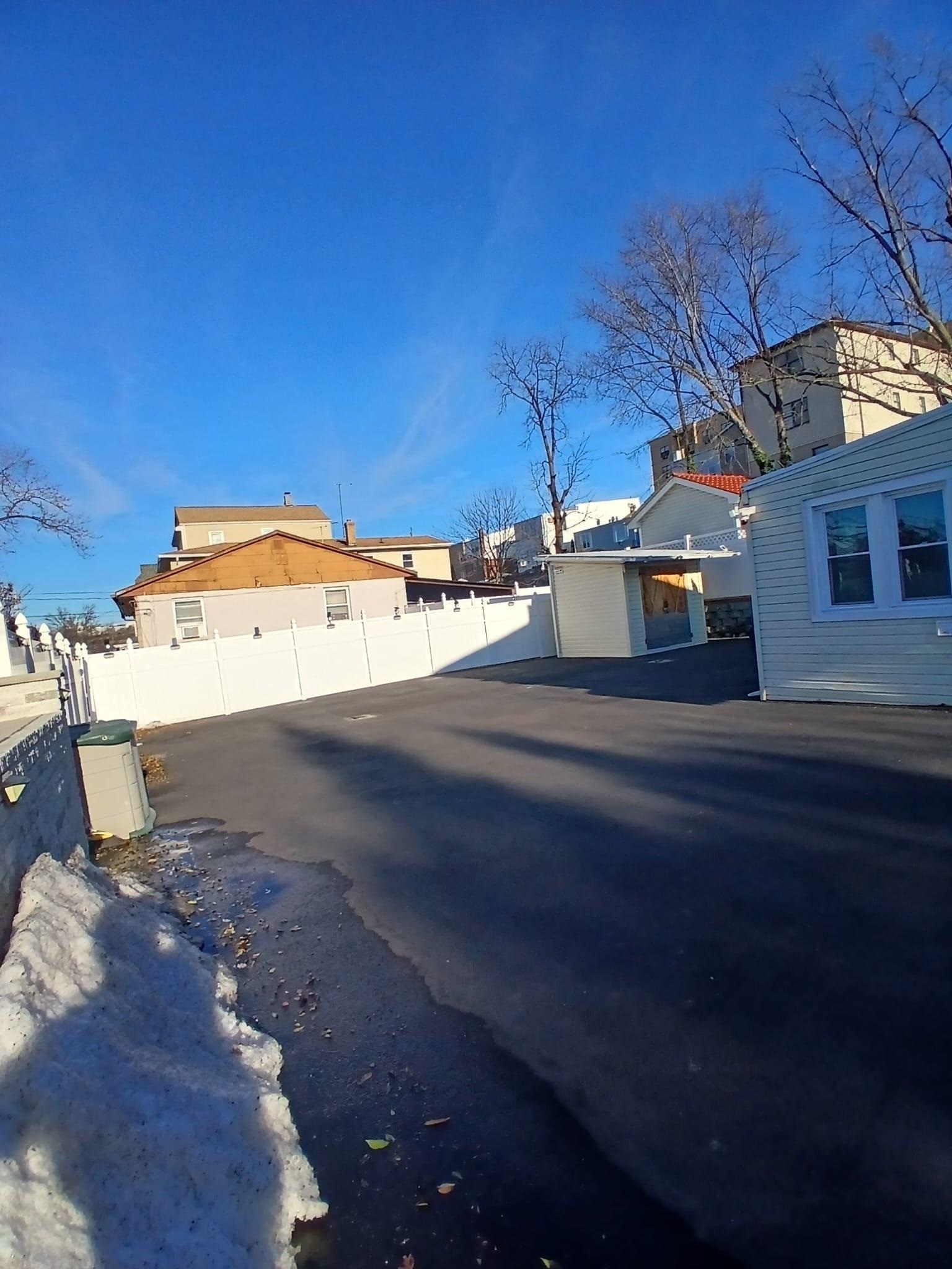1212 89th Street North Bergen, NJ 07047 - Photo 24 of 41 a view of a street with a garage
