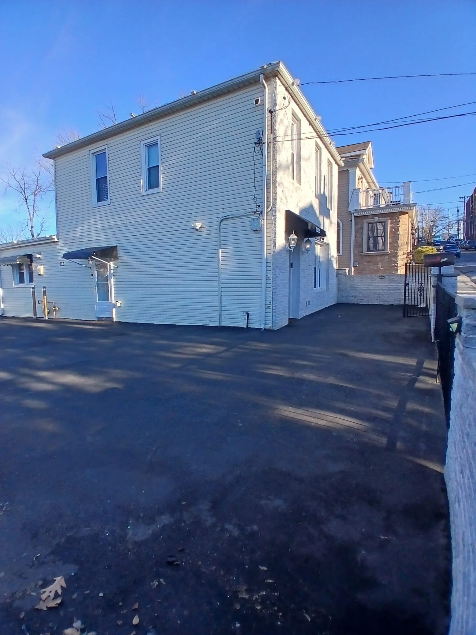 1212 89th Street North Bergen, NJ 07047 - Photo 28 of 41 a view of a house with a backyard