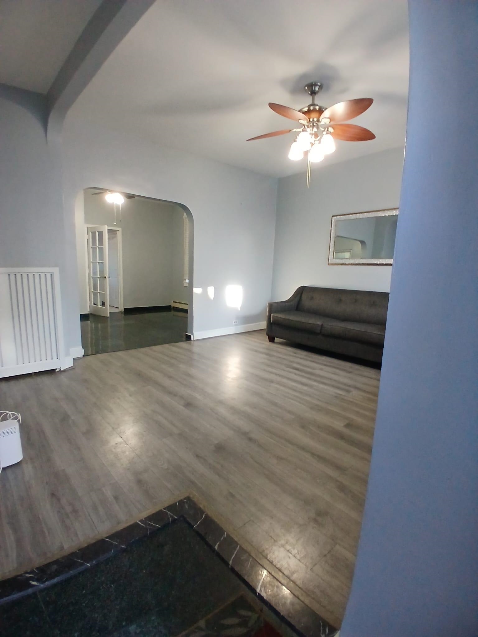 1212 89th Street North Bergen, NJ 07047 - Photo 5 of 41 a view of empty room with wooden floor