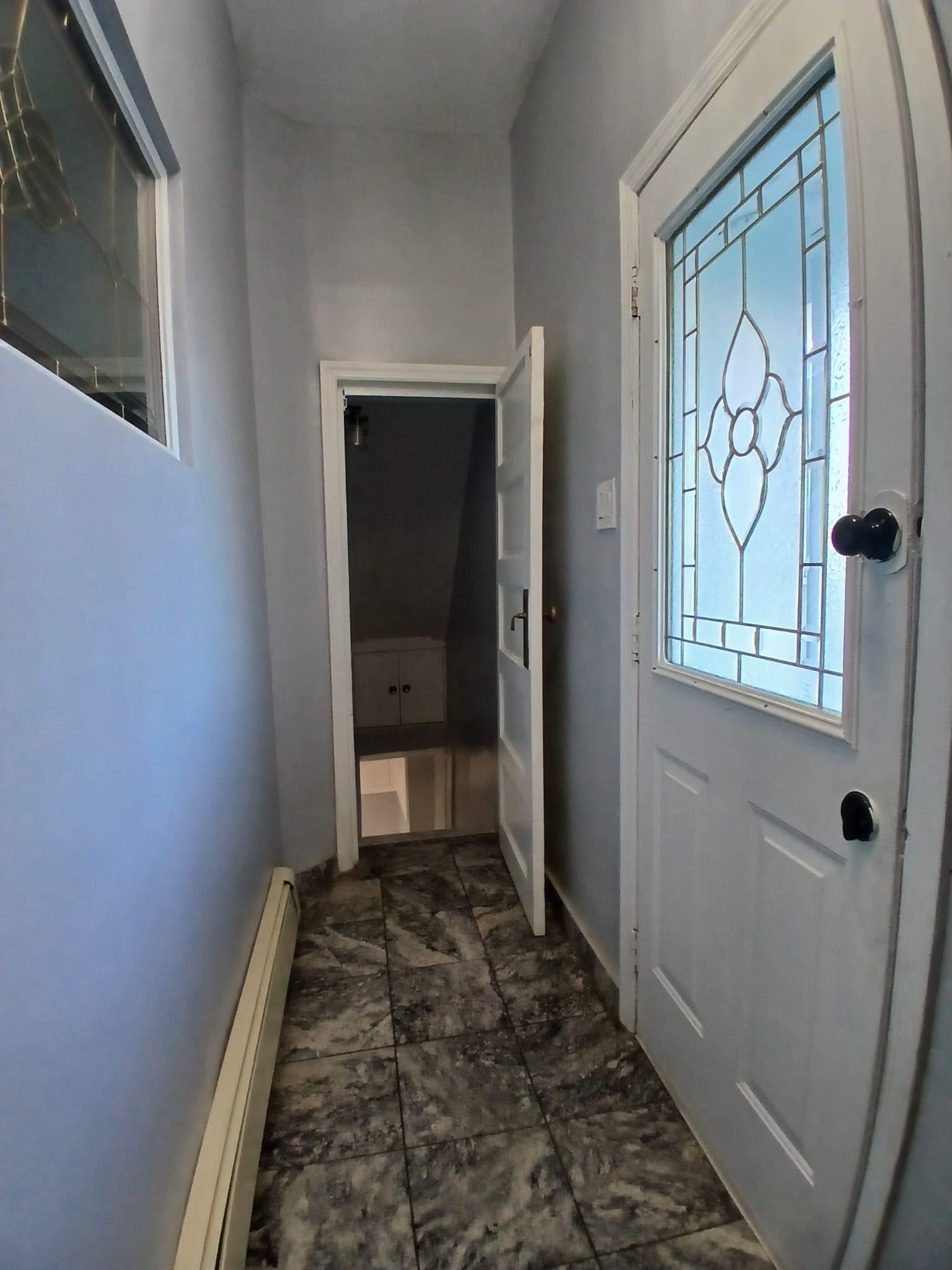 1212 89th Street North Bergen, NJ 07047 - Photo 6 of 41 a bathroom with a granite countertop window and a shower
