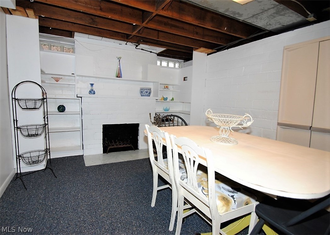2464 Fenwick Road Cleveland, OH 44118 - Photo 19 of 23 PARTIALLY FINISHED BASEMENT WITH FIREPLACE AND BUILT IN SHELVING