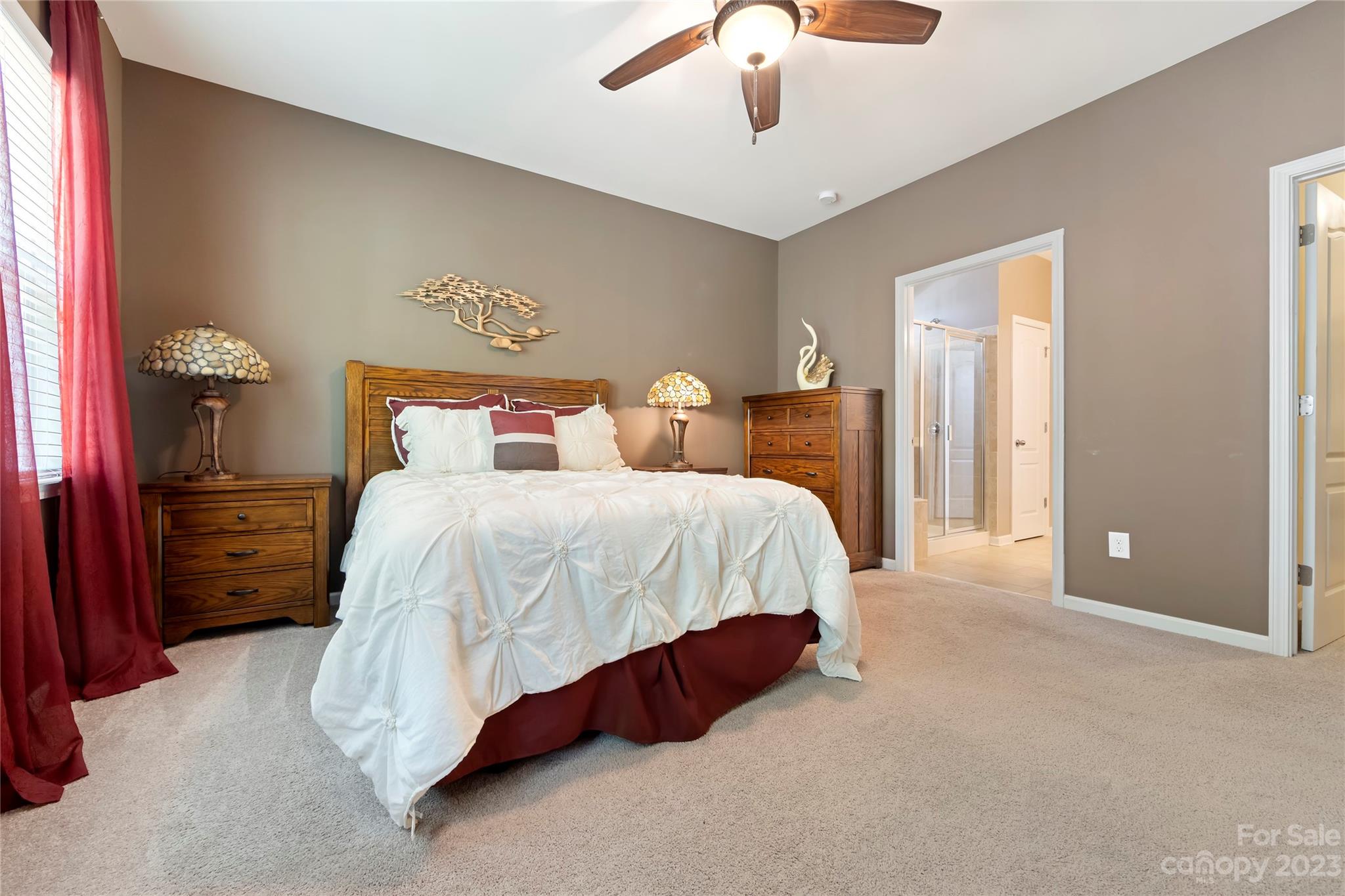 4087 Perth Road Indian Land, SC 29707 - Photo 23 of 46 a spacious bedroom with a bed and a chandelier