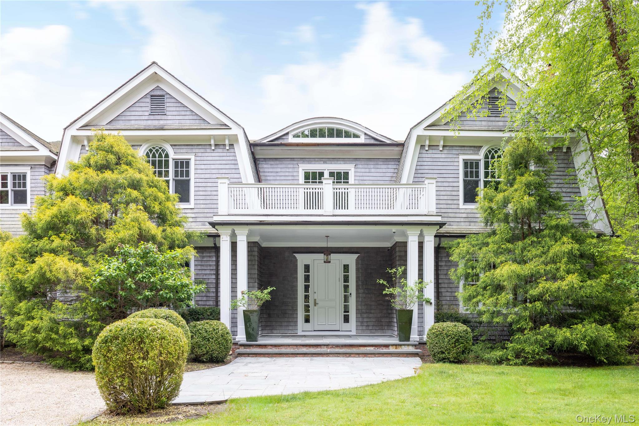 486 Middle Line Highway Bridgehampton, NY 11976 - Photo 2 of 25 front view of a house with a yard