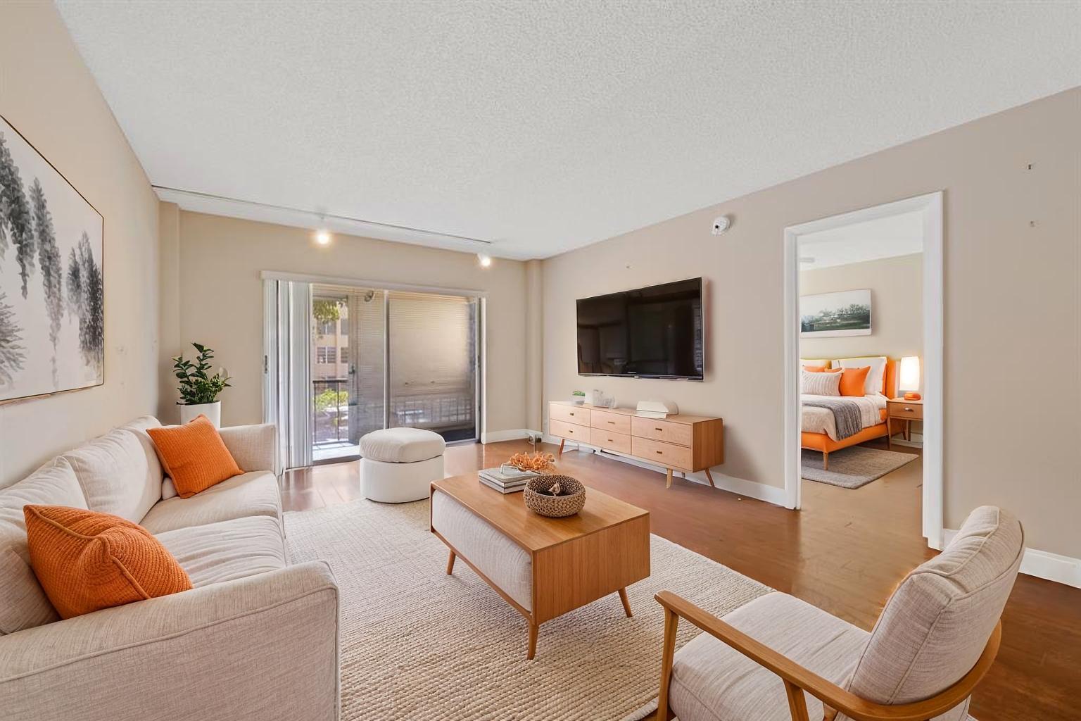 4156 Inverrary Drive, Unit 210 Lauderhill, FL 33319 - Photo 16 of 27 a living room with furniture and a flat screen tv