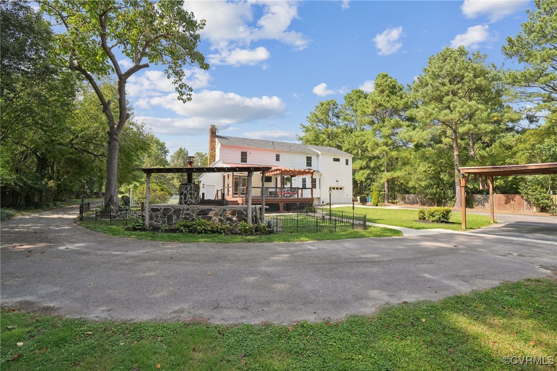 7101 Conifer Road Richmond, VA 23237 - Photo 11 of 50 a view of a house with a yard and sitting area