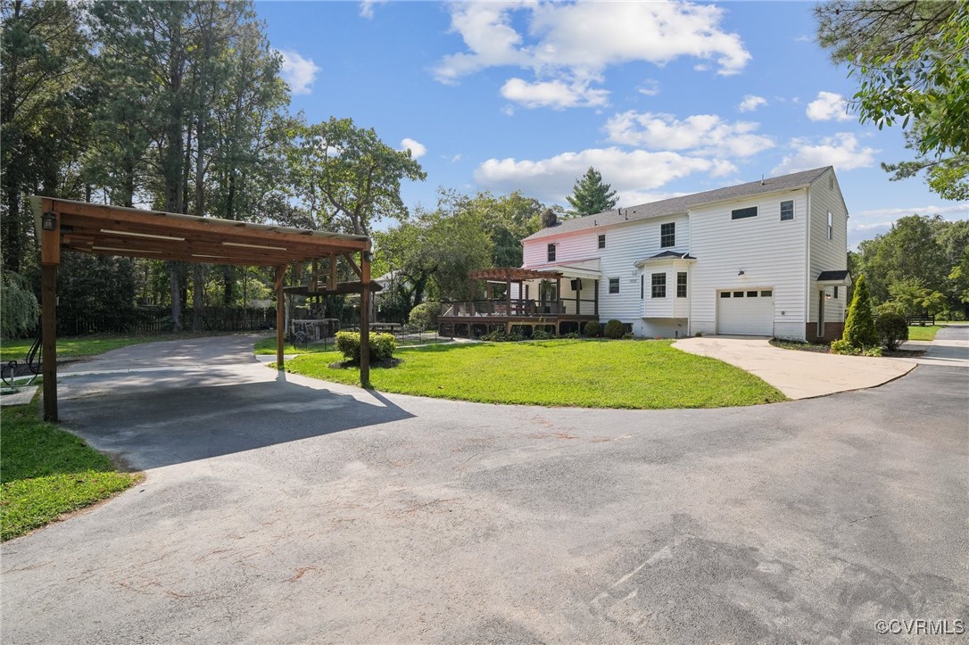 7101 Conifer Road Richmond, VA 23237 - Photo 15 of 50 a view of yard with swimming pool and seating area