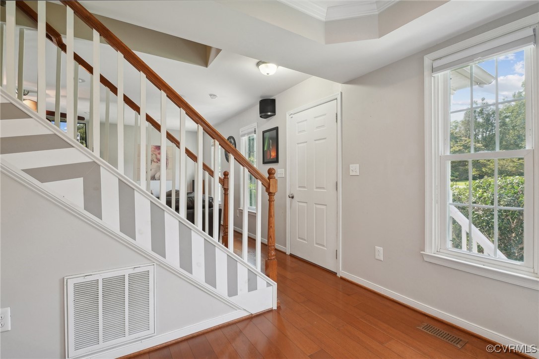 7101 Conifer Road Richmond, VA 23237 - Photo 16 of 50 a view of an entryway with wooden floor and windows