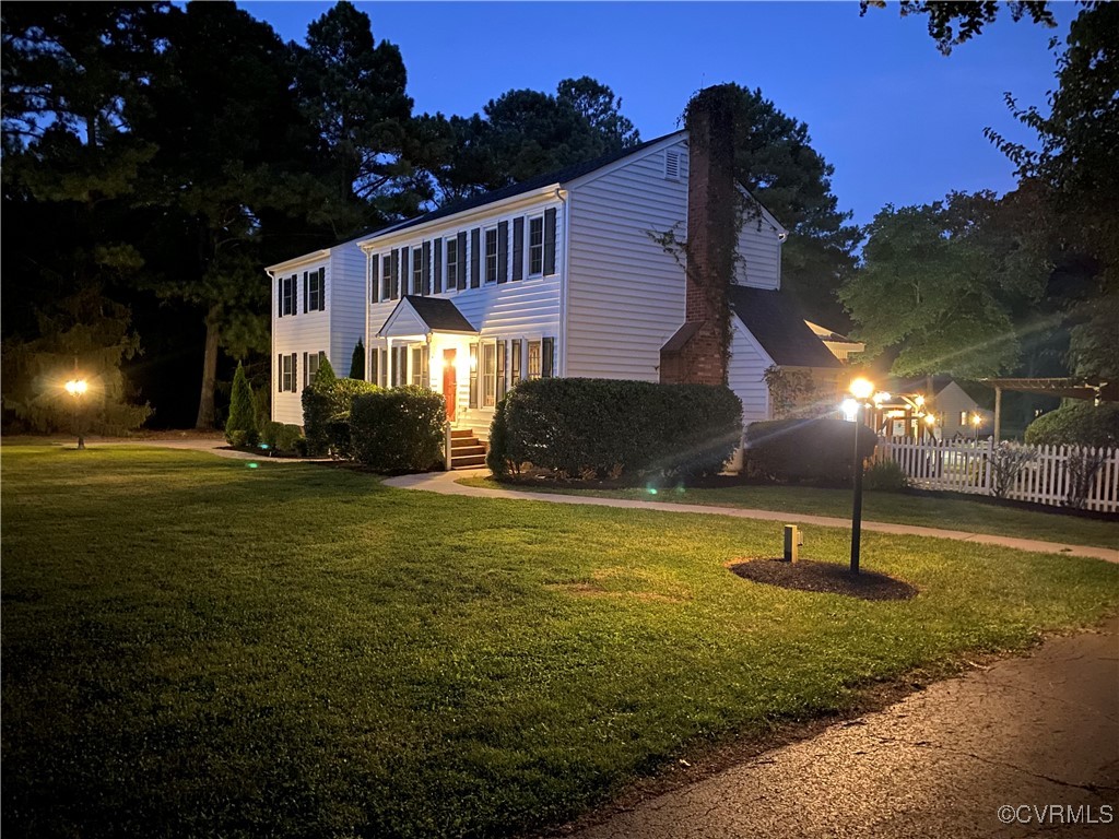 7101 Conifer Road Richmond, VA 23237 - Photo 2 of 50 a swimming pool with some trees in the background