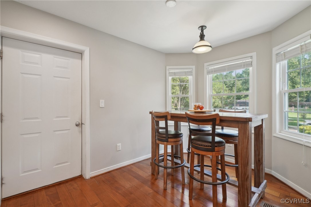 7101 Conifer Road Richmond, VA 23237 - Photo 21 of 50 a view of a dining room with furniture window and outside view