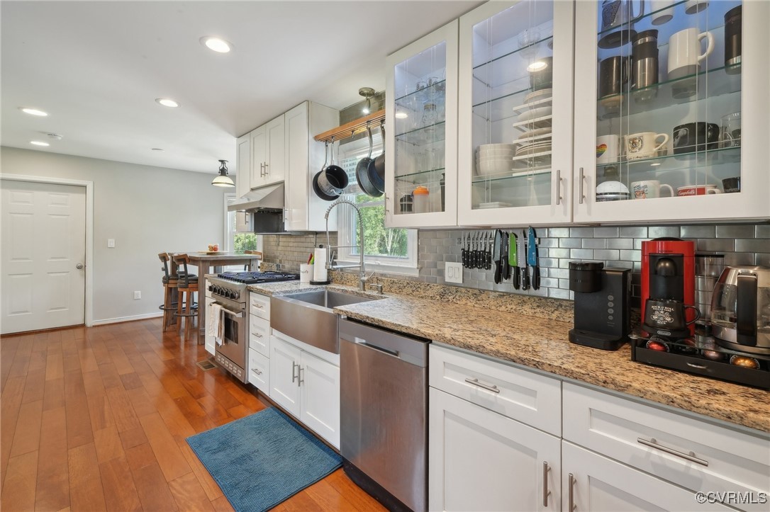 7101 Conifer Road Richmond, VA 23237 - Photo 23 of 50 a kitchen with stainless steel appliances granite countertop a stove and a wooden floors