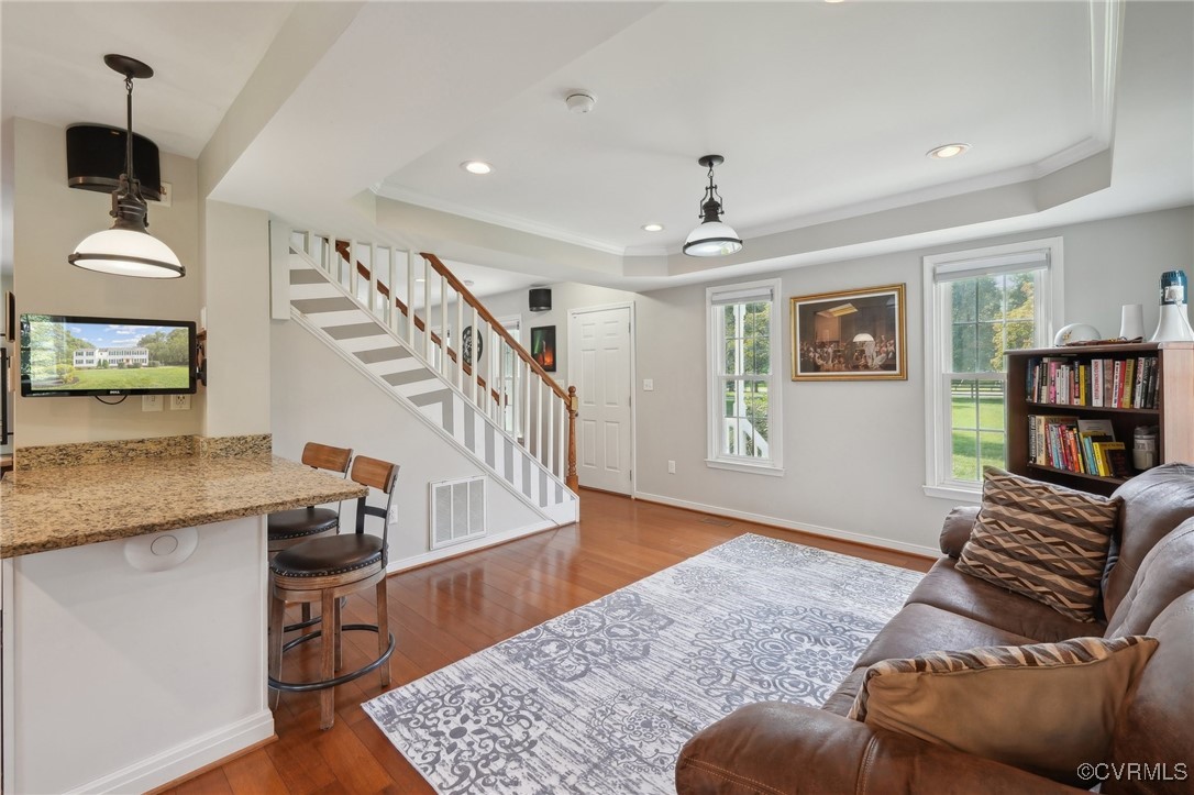 7101 Conifer Road Richmond, VA 23237 - Photo 24 of 50 a living room with furniture and a book shelf