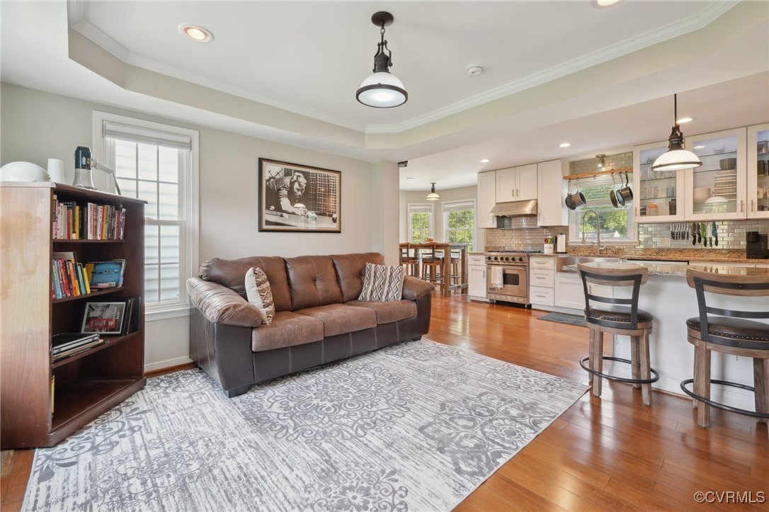 7101 Conifer Road Richmond, VA 23237 - Photo 25 of 50 a living room with furniture and a wooden floor