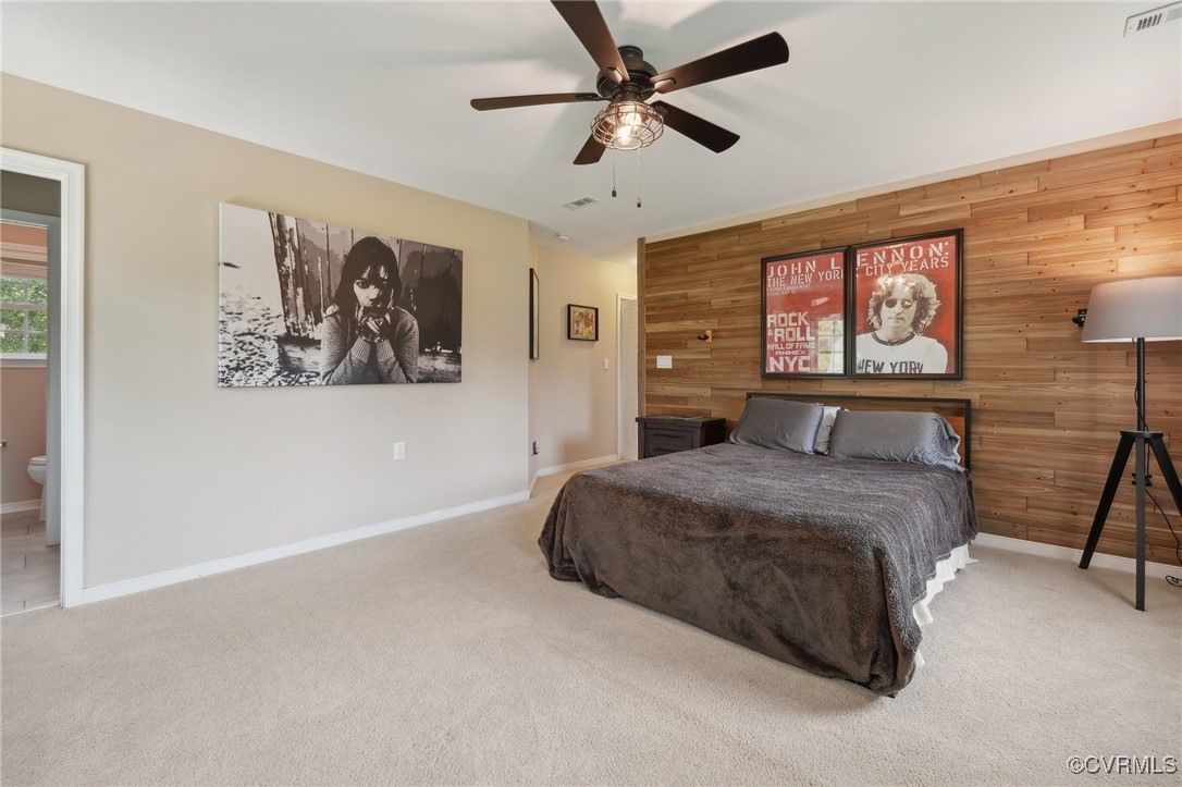 7101 Conifer Road Richmond, VA 23237 - Photo 28 of 50 a spacious bedroom with a bed and a chandelier