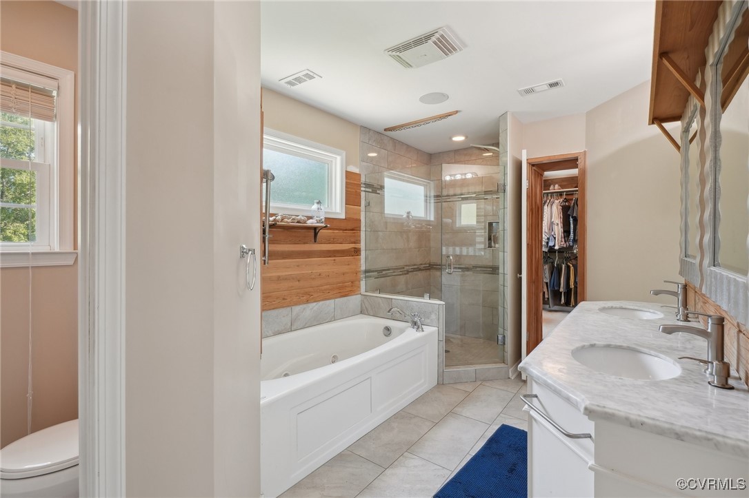 7101 Conifer Road Richmond, VA 23237 - Photo 29 of 50 a bathroom with a granite countertop sink a toilet and shower