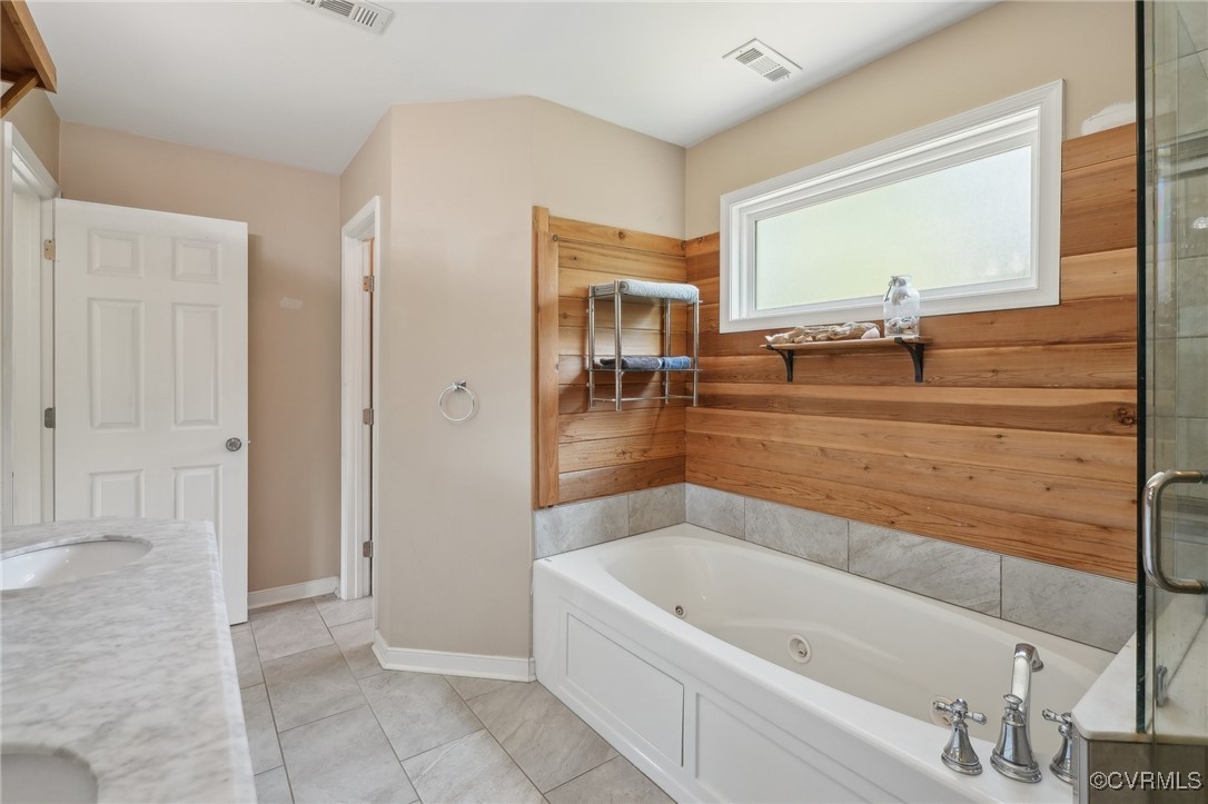 7101 Conifer Road Richmond, VA 23237 - Photo 30 of 50 a bathroom with a bathtub and a sink