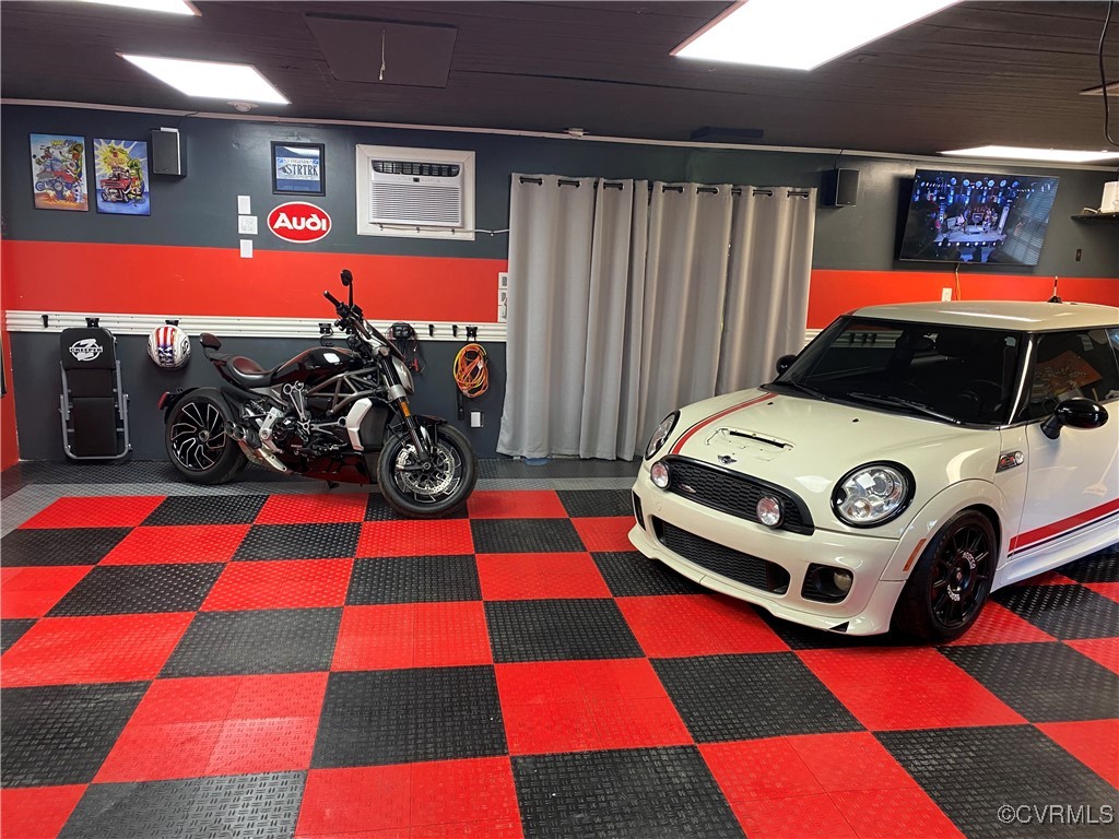 7101 Conifer Road Richmond, VA 23237 - Photo 40 of 50 a utility room with a checkered floor and a rug