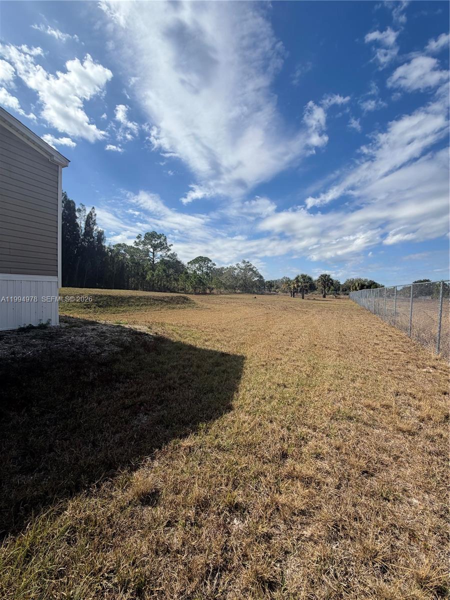 130 North Granja Street Clewiston, FL 33440 - Photo 10 of 10 a view of a lake with houses in the back