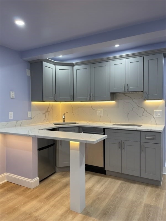 45 Oval Road, Unit 6 Quincy, MA 02170 - Photo 1 of 9 a view of an empty room with cabinet and a sink