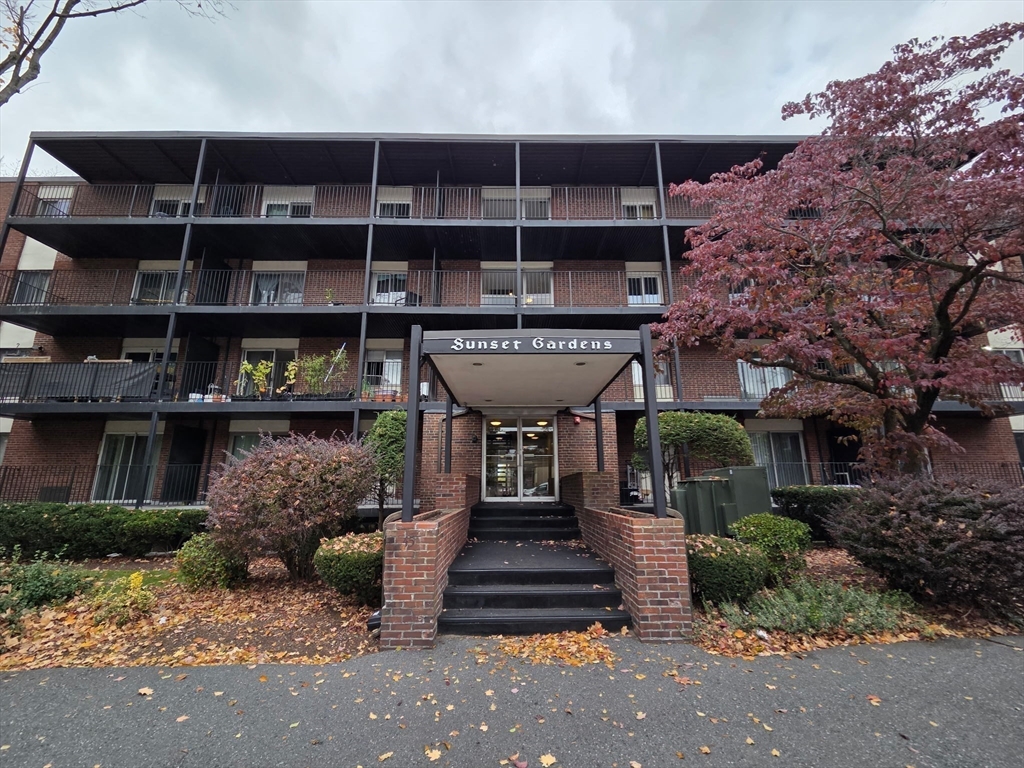 45 Oval Road, Unit 6 Quincy, MA 02170 - Photo 4 of 9 a front view of a house with a garden