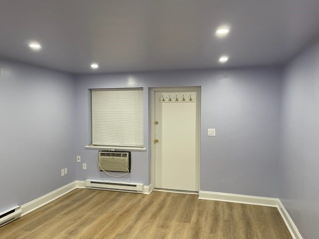 45 Oval Road, Unit 6 Quincy, MA 02170 - Photo 6 of 9 an empty room with wooden floor and a empty room