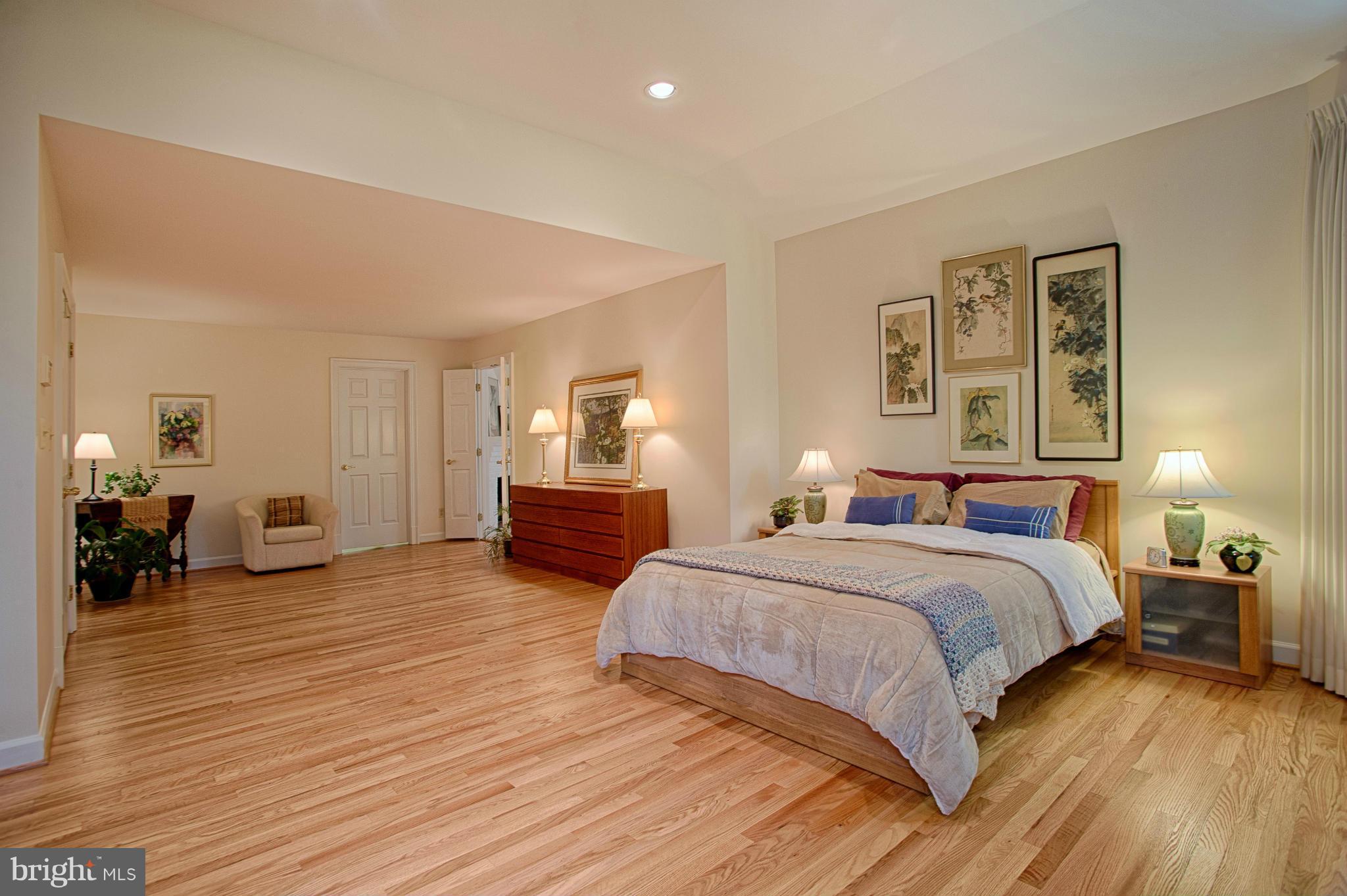 11311 Fieldstone Lane Reston, VA 20191 - Photo 12 of 30 a bedroom with a bed and wooden floor