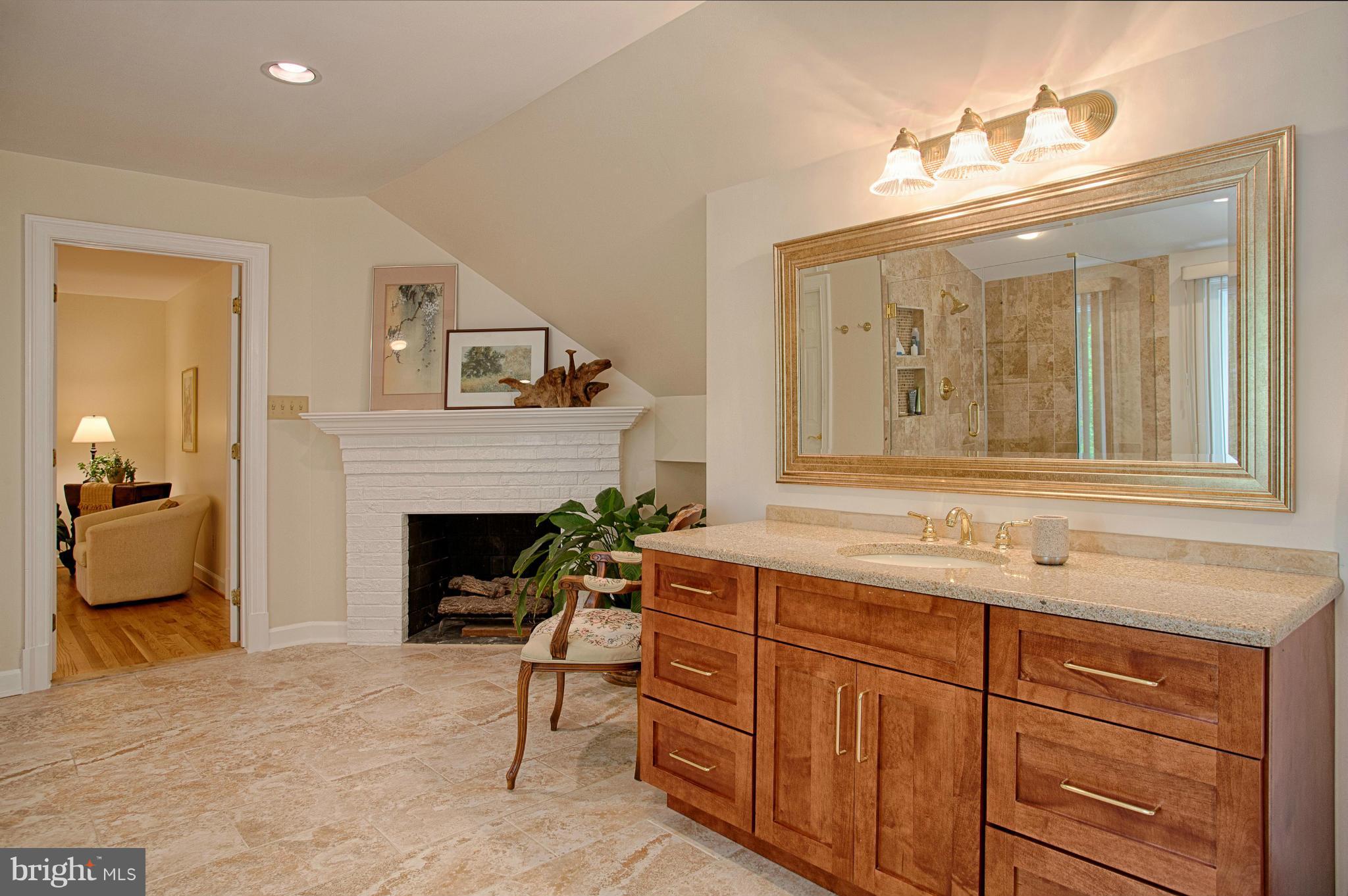 11311 Fieldstone Lane Reston, VA 20191 - Photo 15 of 30 a living room with furniture and a fireplace