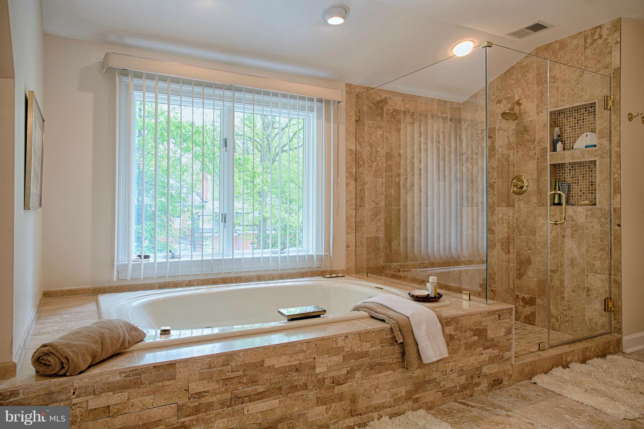 11311 Fieldstone Lane Reston, VA 20191 - Photo 16 of 30 a bathroom with a tub a sink and a shower