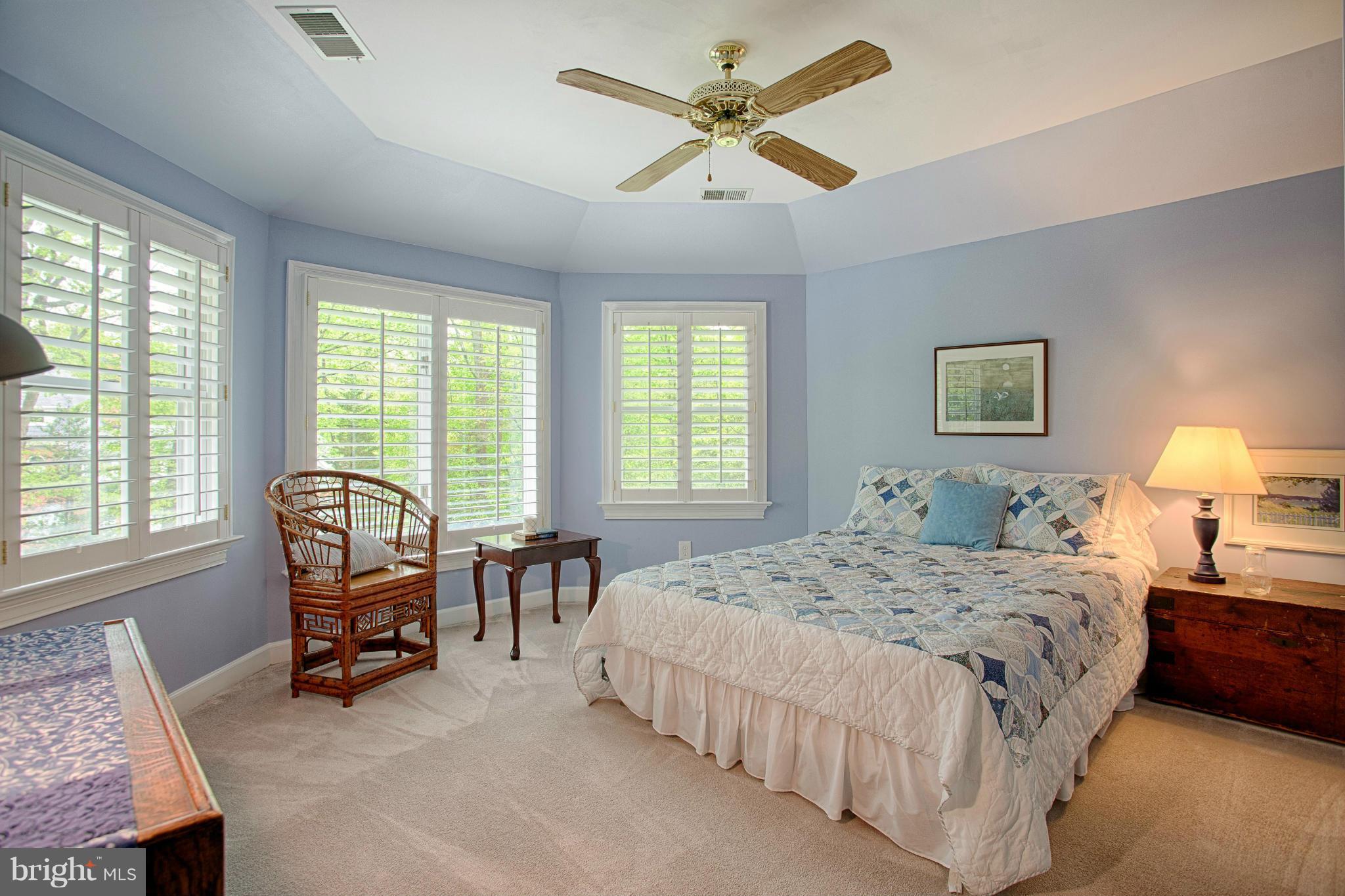 11311 Fieldstone Lane Reston, VA 20191 - Photo 17 of 30 a bedroom with a bed chairs and a window