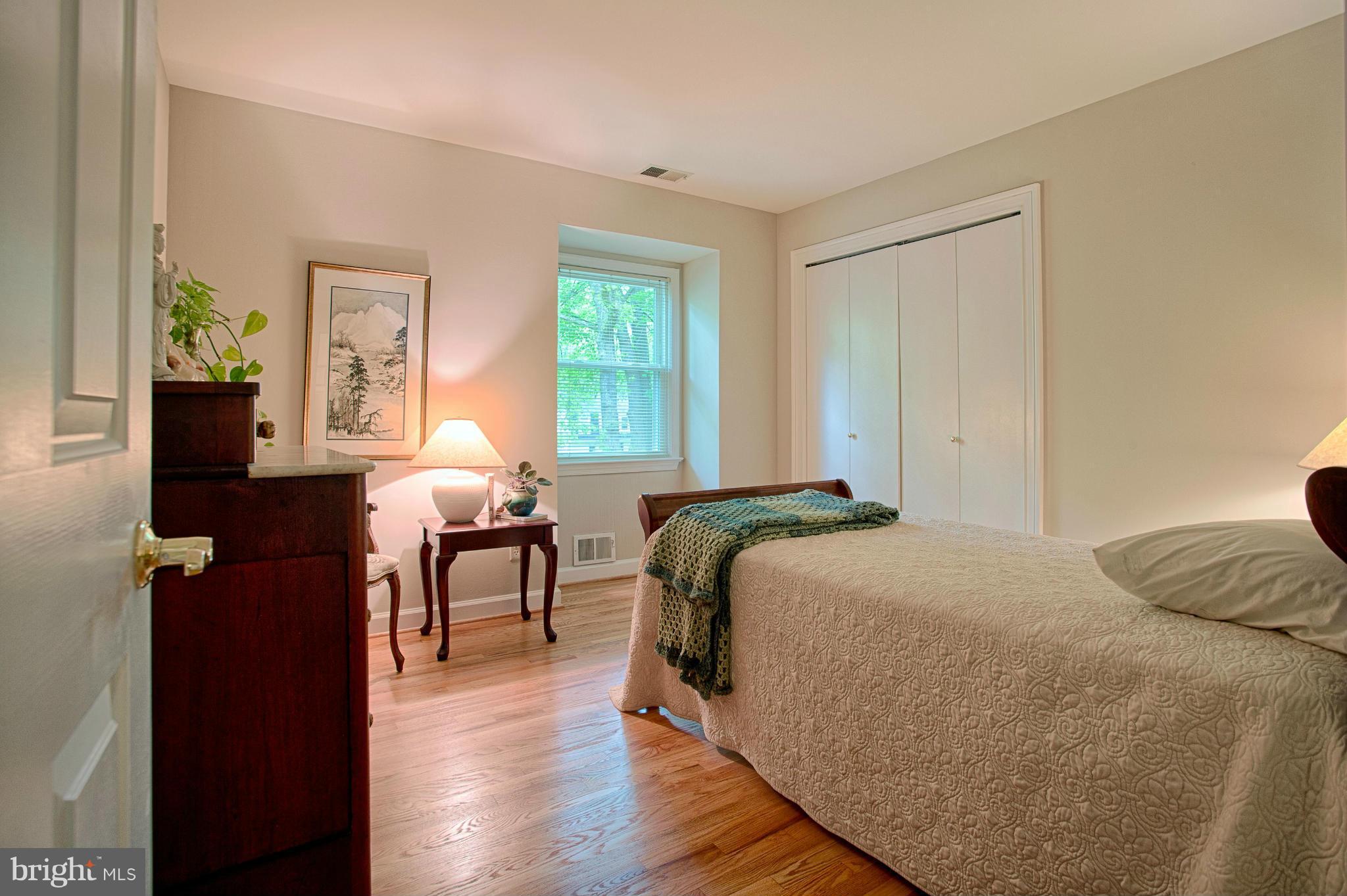 11311 Fieldstone Lane Reston, VA 20191 - Photo 21 of 30 a bedroom with a bed and a table chair