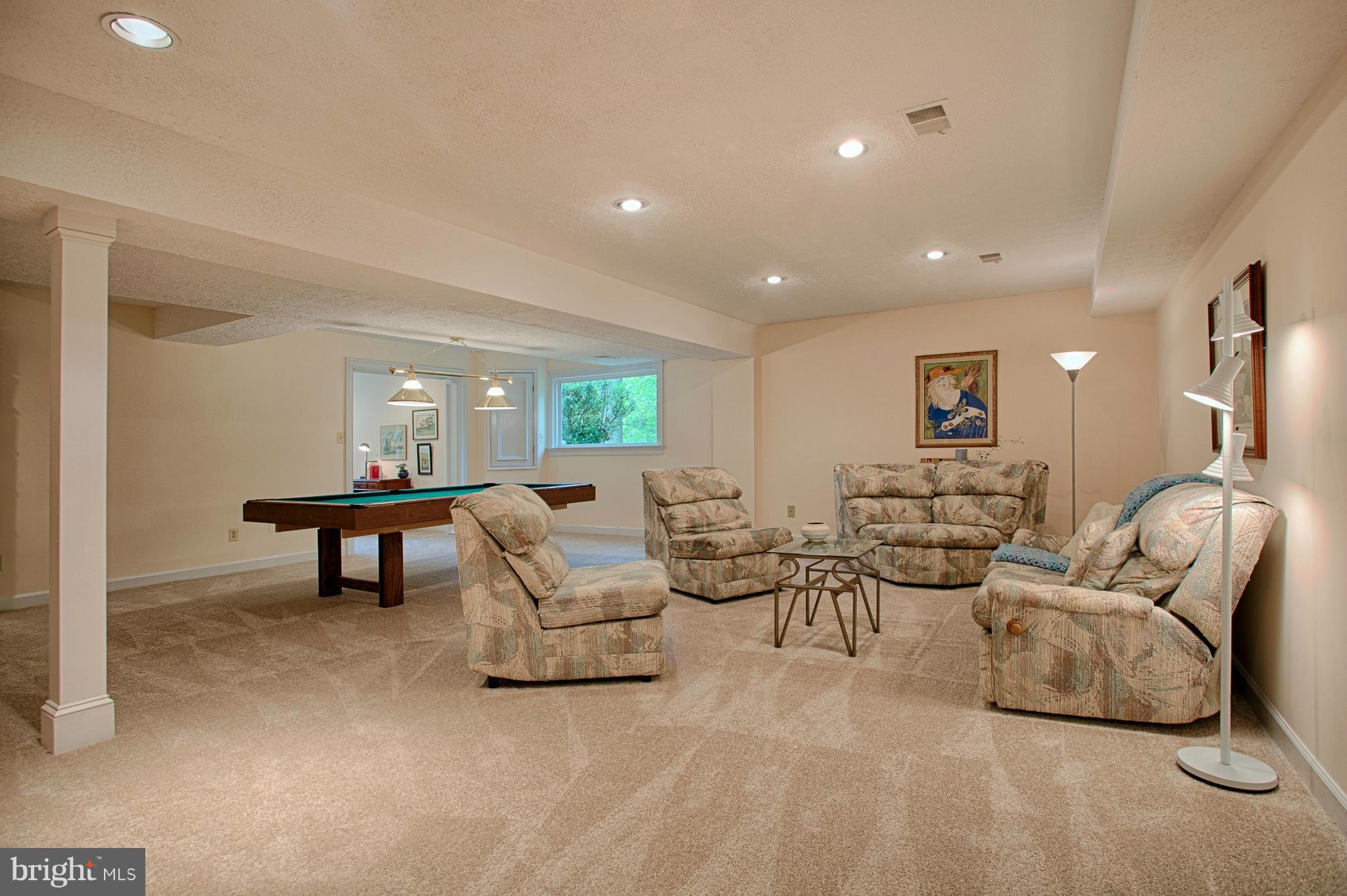 11311 Fieldstone Lane Reston, VA 20191 - Photo 22 of 30 a living room with furniture and a wooden floor