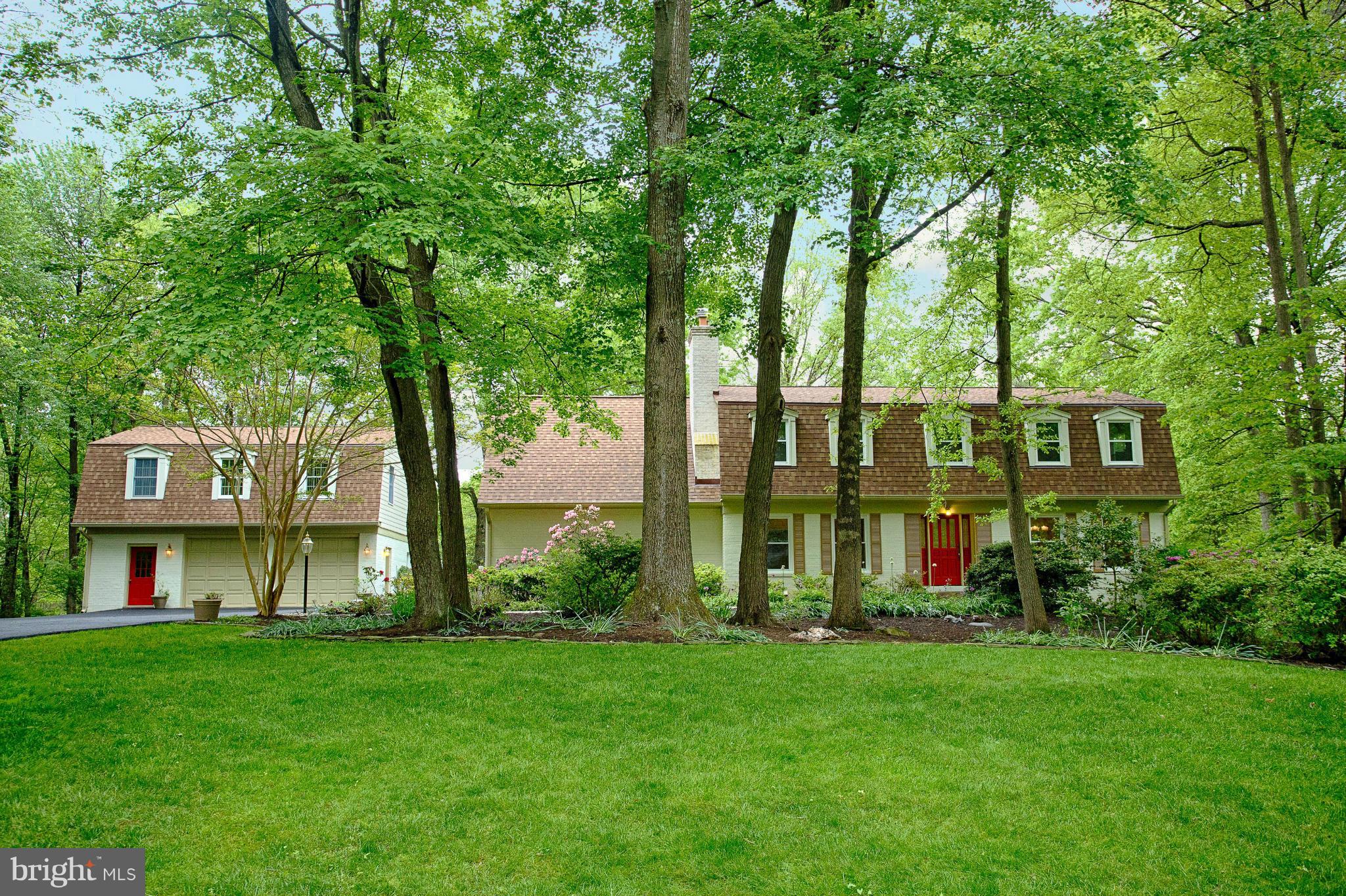 11311 Fieldstone Lane Reston, VA 20191 - Photo 27 of 30 a view of a brick house with a large windows and large trees