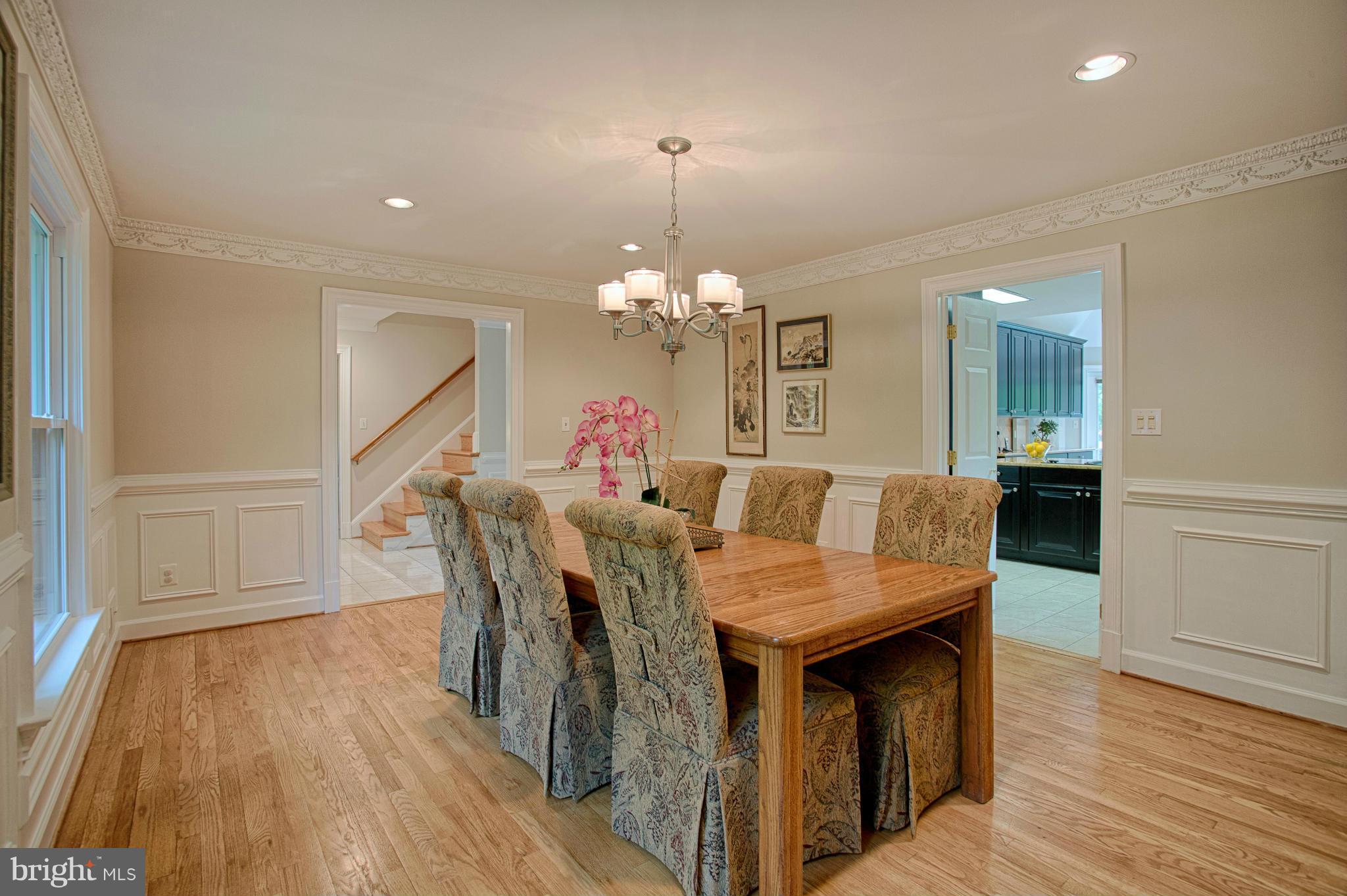 11311 Fieldstone Lane Reston, VA 20191 - Photo 4 of 30 a view of a dining room with furniture and wooden floor