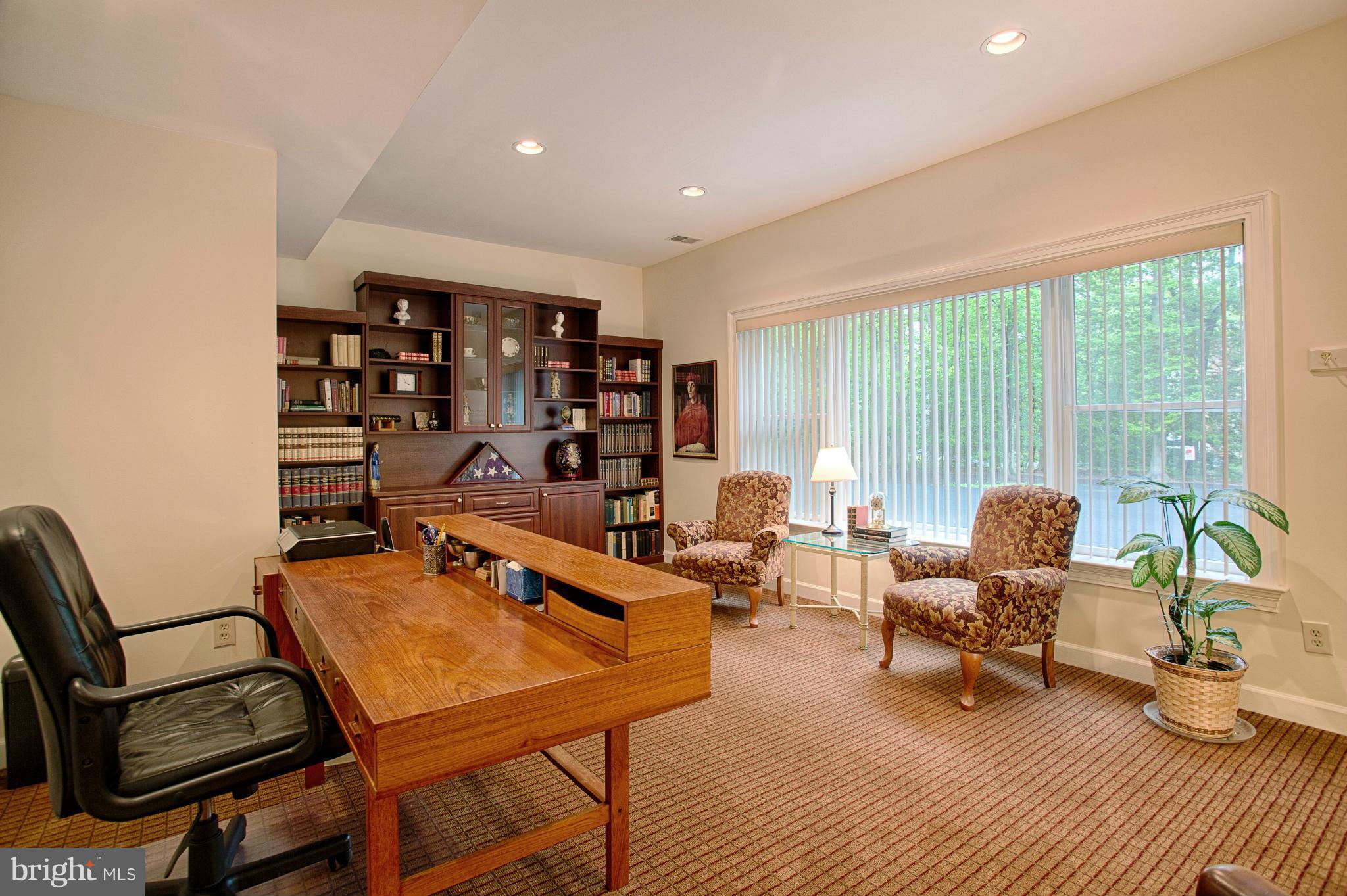 11311 Fieldstone Lane Reston, VA 20191 - Photo 10 of 30 a living room with furniture a rug and a large window