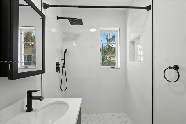 a bathroom with a sink and mirror