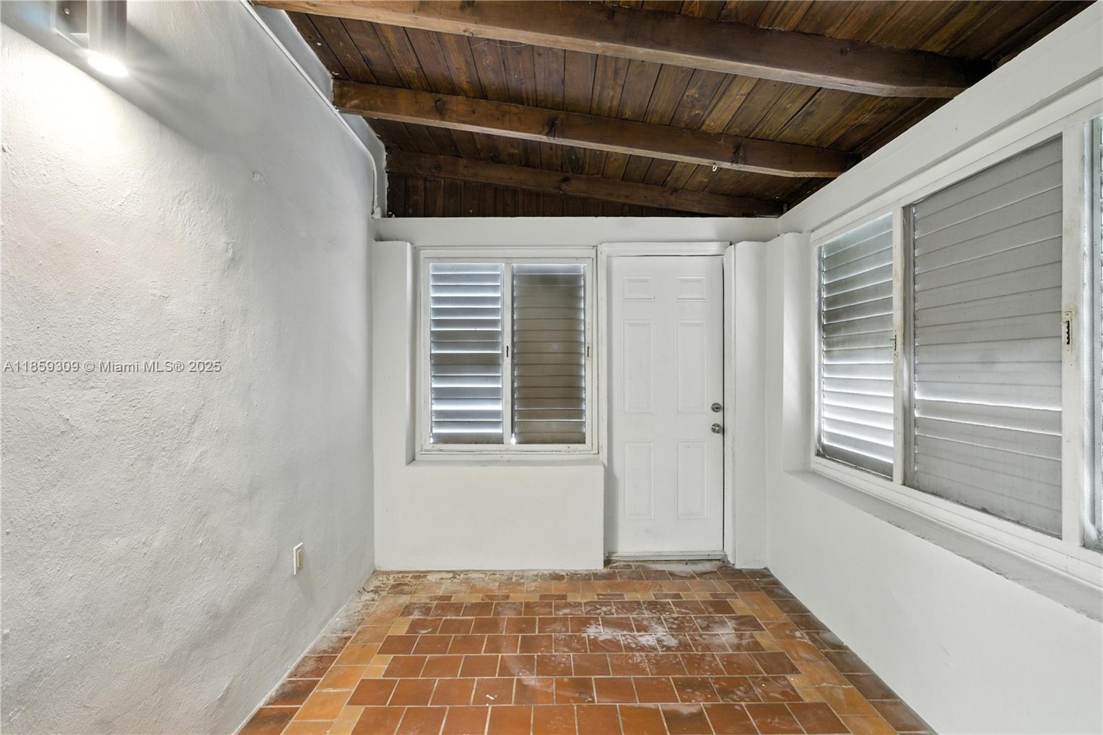 2545 Southwest 27th Lane Miami, FL 33133 - Photo 21 of 26 a view of an empty room with a window