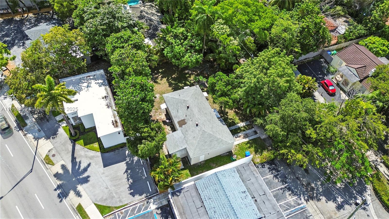 2545 Southwest 27th Lane Miami, FL 33133 - Photo 22 of 26 an aerial view of a house with a yard and garden