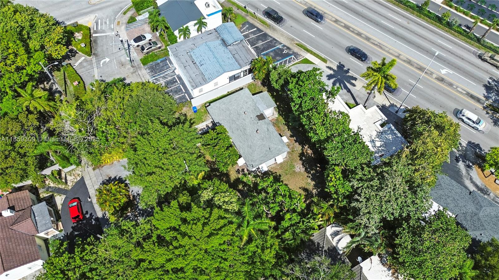 2545 Southwest 27th Lane Miami, FL 33133 - Photo 24 of 26 an aerial view of a house with a yard and garden