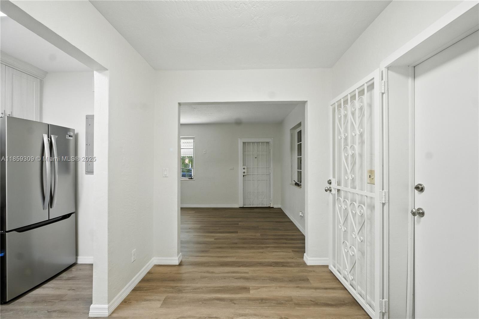 2545 Southwest 27th Lane Miami, FL 33133 - Photo 9 of 26 a view of a hallway with wooden floor
