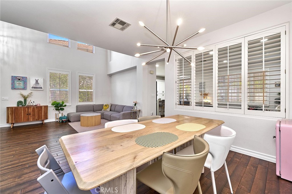 25553 Fitzgerald Avenue Stevenson Ranch, CA 91381 - Photo 11 of 40 a dining room with furniture and wooden floor