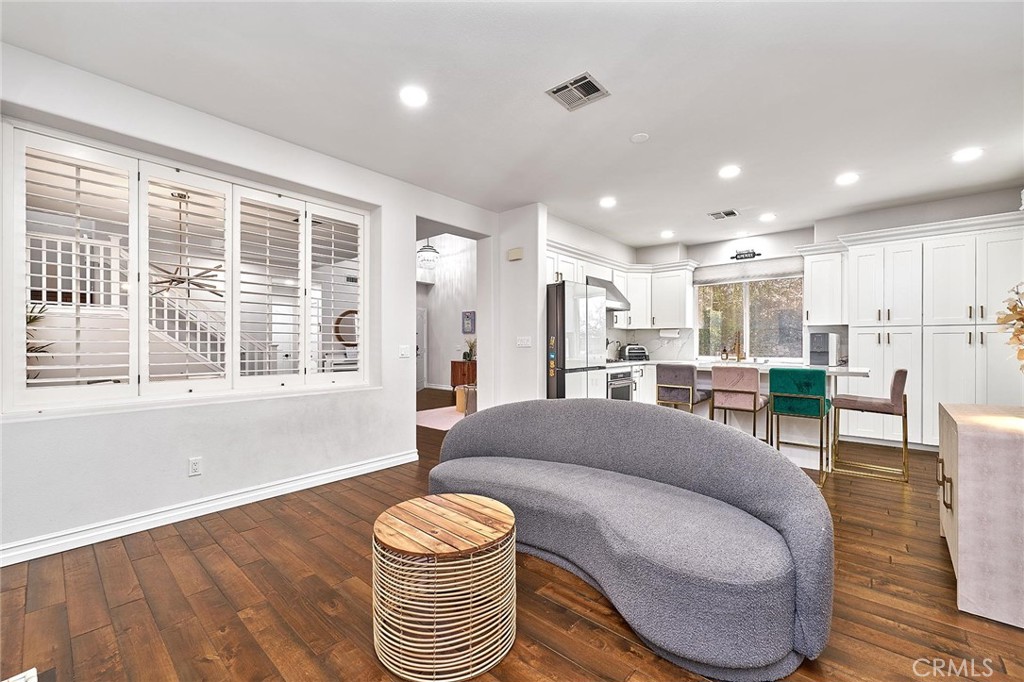25553 Fitzgerald Avenue Stevenson Ranch, CA 91381 - Photo 14 of 40 a living room with furniture and a large window