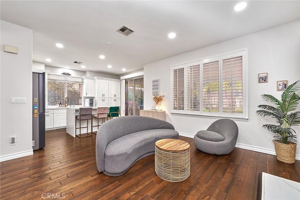 25553 Fitzgerald Avenue Stevenson Ranch, CA 91381 - Photo 15 of 40 a living room with furniture and a large window