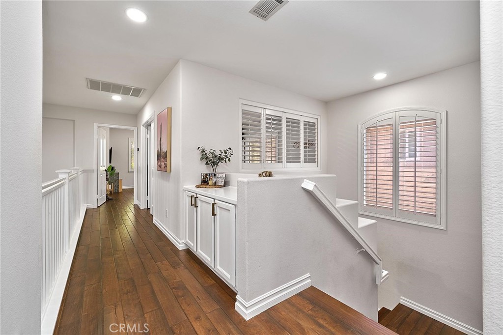 25553 Fitzgerald Avenue Stevenson Ranch, CA 91381 - Photo 21 of 40 a view of a kitchen with a sink and wooden floor