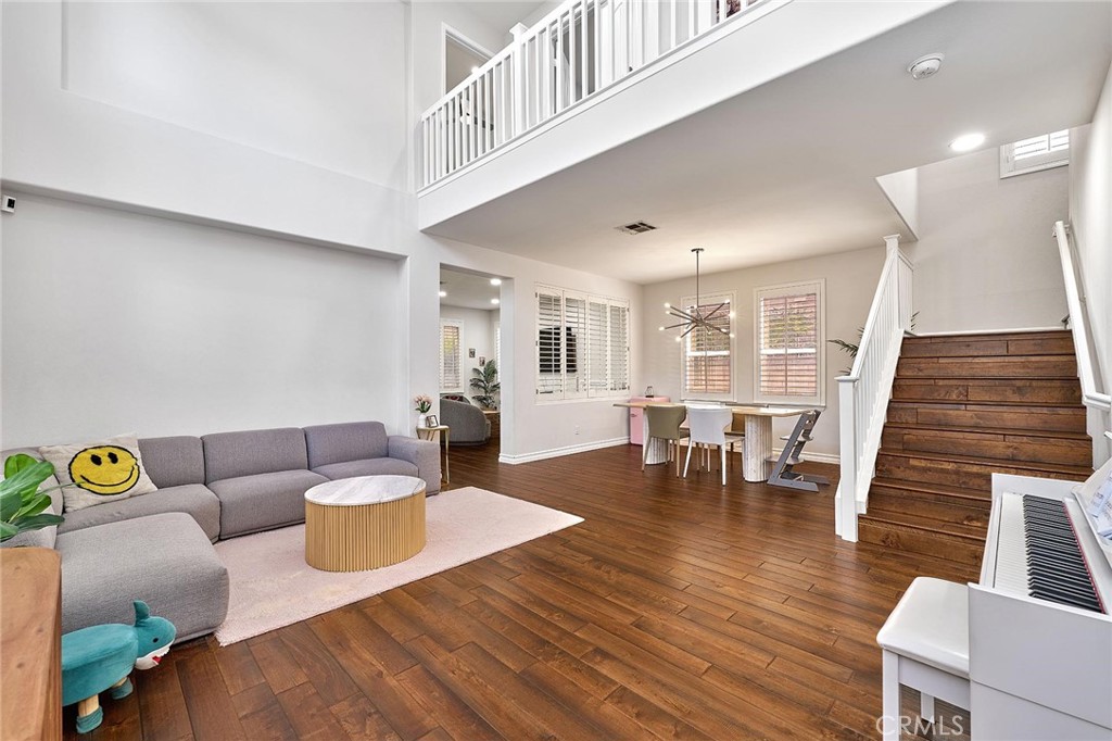 25553 Fitzgerald Avenue Stevenson Ranch, CA 91381 - Photo 3 of 40 a living room with furniture and wooden floor