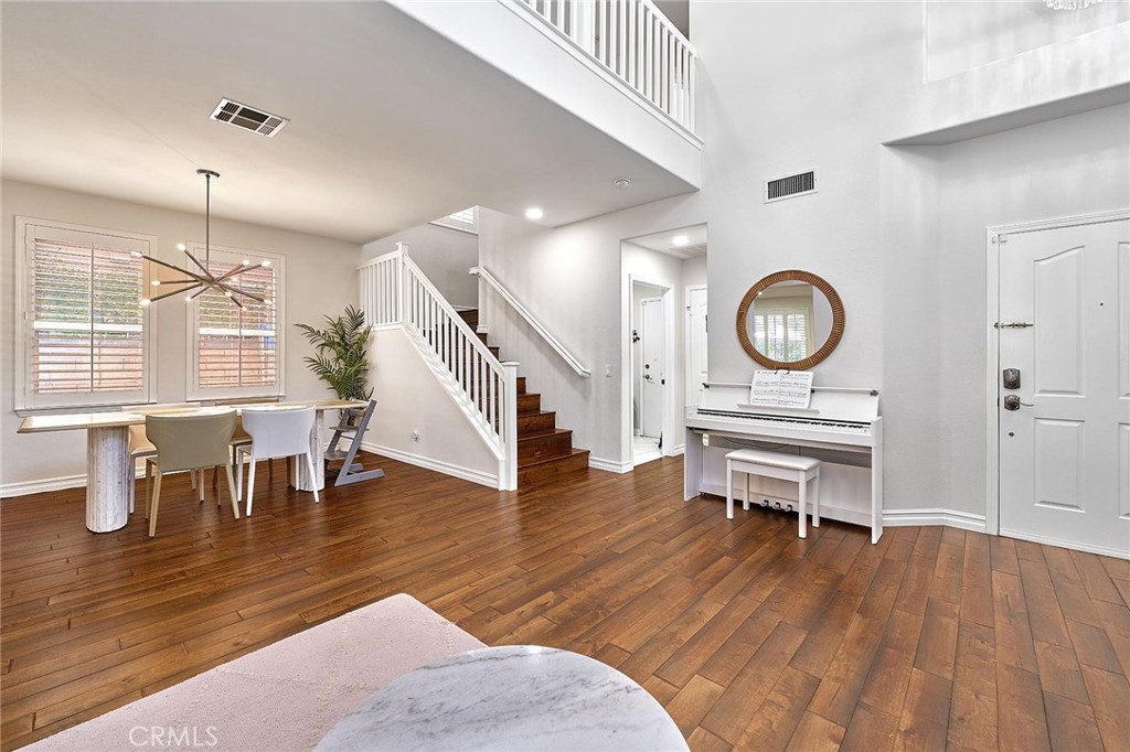 25553 Fitzgerald Avenue Stevenson Ranch, CA 91381 - Photo 5 of 40 a living room with furniture and a wooden floor