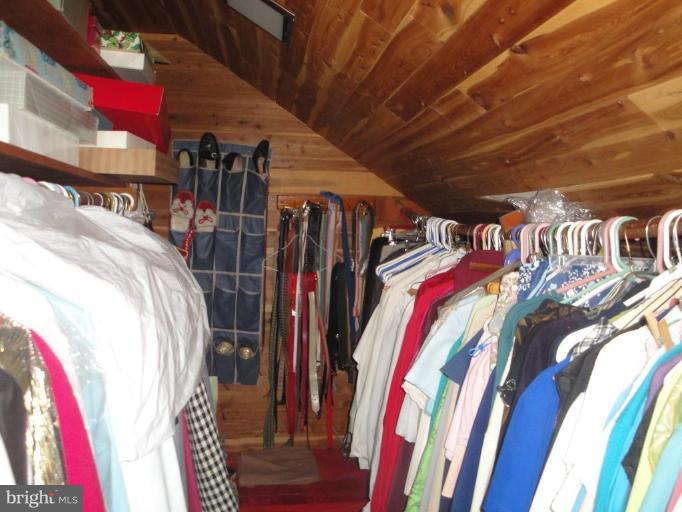 8202 Maple Ridge Road Bethesda, MD 20814 - Photo 8 of 13 a view of walk in closet with clothes