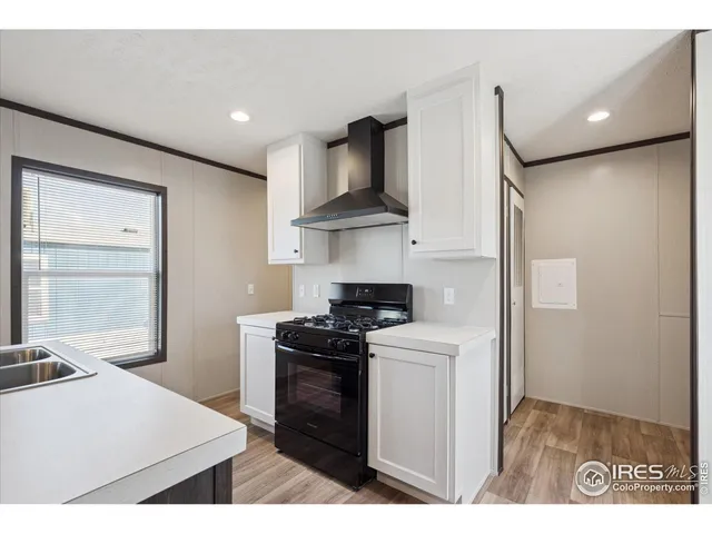 a kitchen with stainless steel appliances granite countertop a stove a refrigerator and a microwave