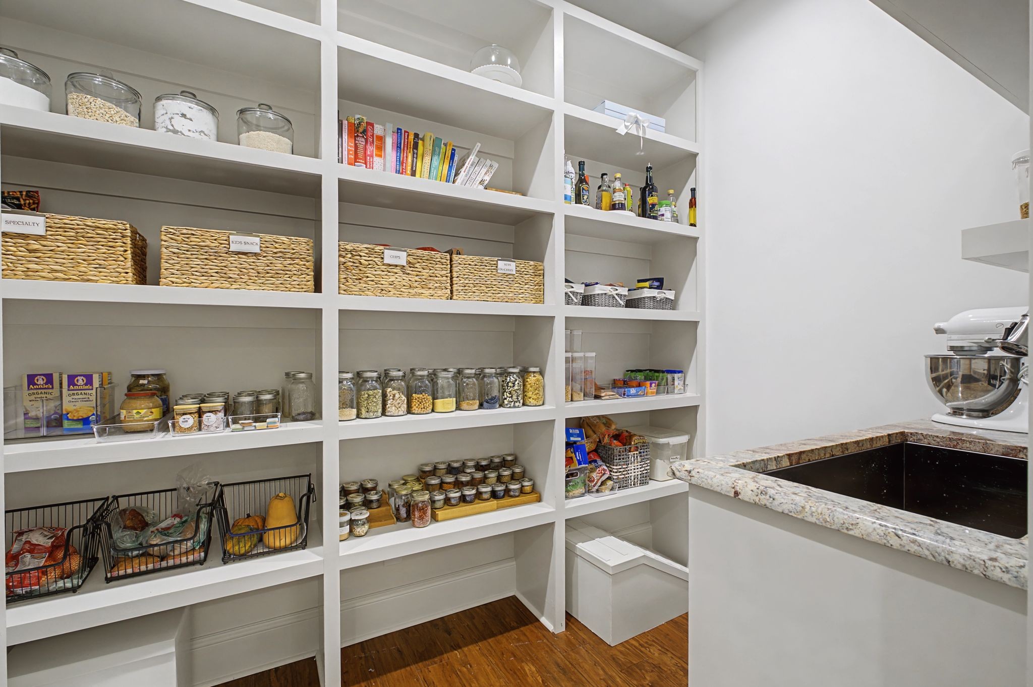 7100 Marsh Hawk Court Arrington, TN 37014 - Photo 24 of 51 a view of kitchen cabinets with food items with white countertops