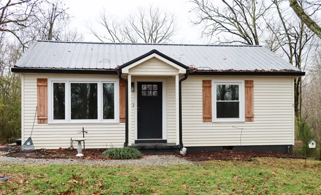a small white house with a outdoor space