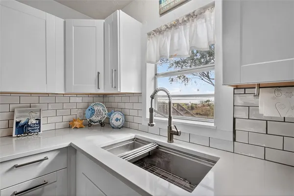 a kitchen with a sink and cabinets