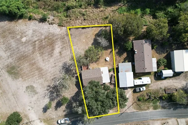 an aerial view of a house having yard